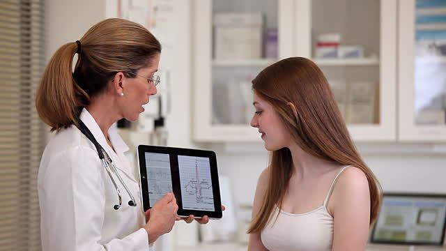 Doctor using EHR for patient